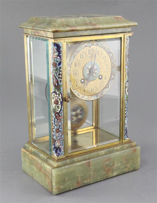 An early 20th century French champlevé enamel and onyx four glass clock, 11.5in.
